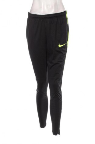 Damskie spodnie sportowe Nike, Rozmiar M, Kolor Czarny, Cena 133,99 zł