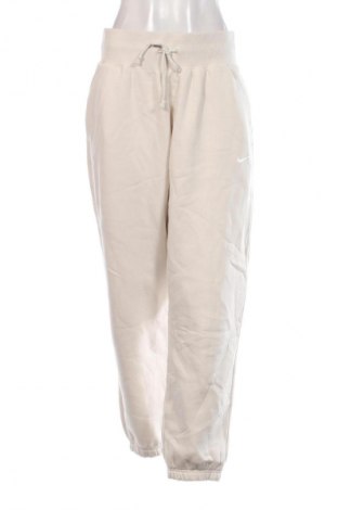 Damen Sporthose Nike, Größe L, Farbe Beige, Preis 39,99 €