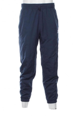 Męskie spodnie sportowe New Balance, Rozmiar M, Kolor Niebieski, Cena 177,99 zł