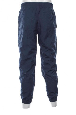 Męskie spodnie sportowe New Balance, Rozmiar M, Kolor Niebieski, Cena 177,99 zł