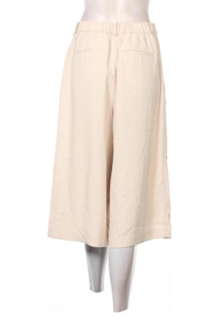 Damskie spodnie Uniqlo, Rozmiar S, Kolor Beżowy, Cena 48,99 zł