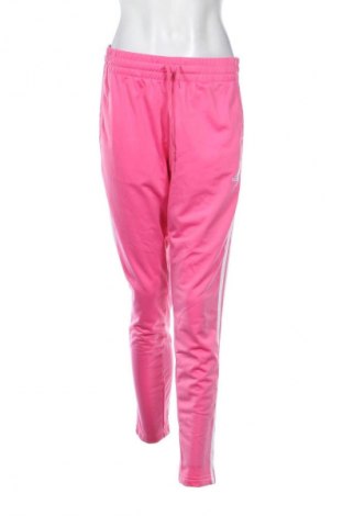 Damskie spodnie sportowe Adidas, Rozmiar L, Kolor Różowy, Cena 116,99 zł