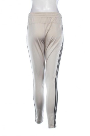 Damskie spodnie sportowe Adidas, Rozmiar S, Kolor Beżowy, Cena 94,25 zł