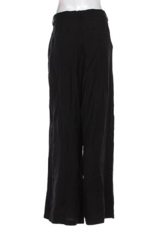 Dámske nohavice Guido Maria Kretschmer for About You, Veľkosť XL, Farba Čierna, Cena  56,95 €