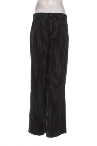 Damskie spodnie Reserved, Rozmiar L, Kolor Kolorowy, Cena 110,34 zł