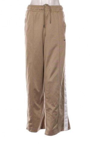 Γυναικείο αθλητικό παντελόνι Nike, Μέγεθος M, Χρώμα  Μπέζ, Τιμή 20,97 €