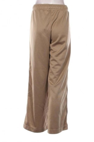 Γυναικείο αθλητικό παντελόνι Nike, Μέγεθος M, Χρώμα  Μπέζ, Τιμή 20,97 €